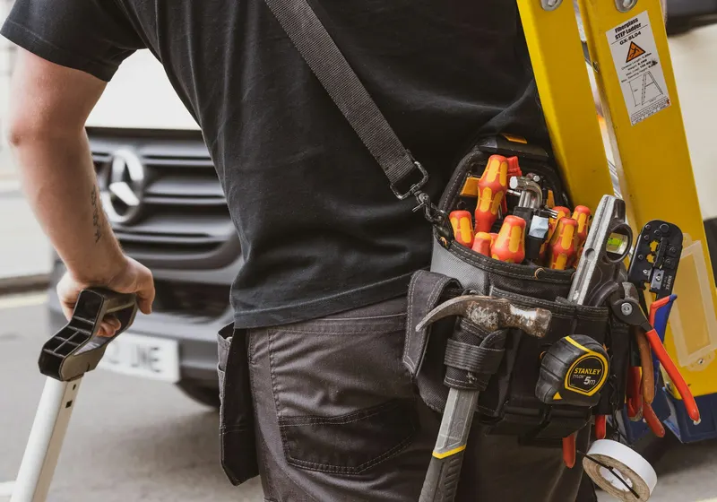 Technician servicing equipment